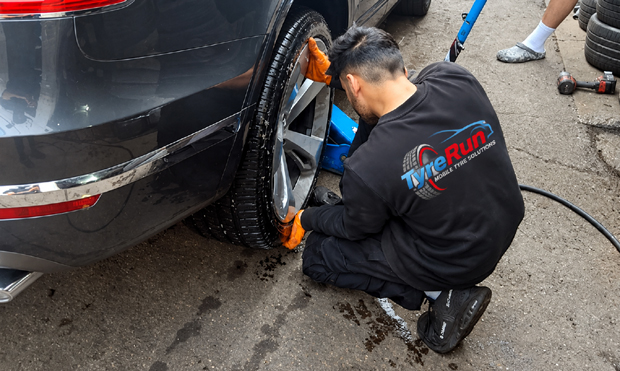 TyreRun fitter fitting a tyre on a customer's car